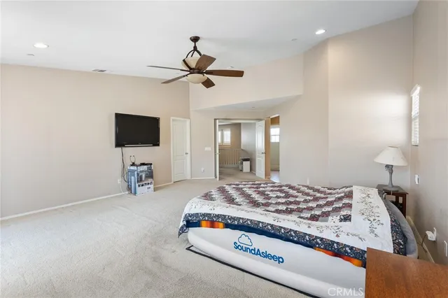 an aerial view of a house with a yard and lake view