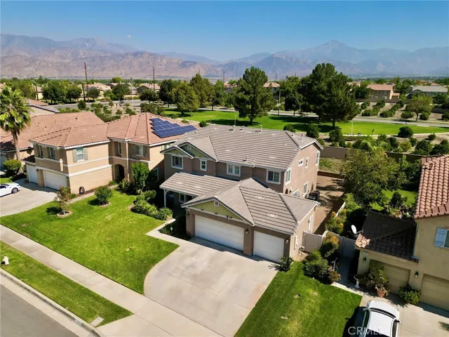 an aerial view of a house with a garden