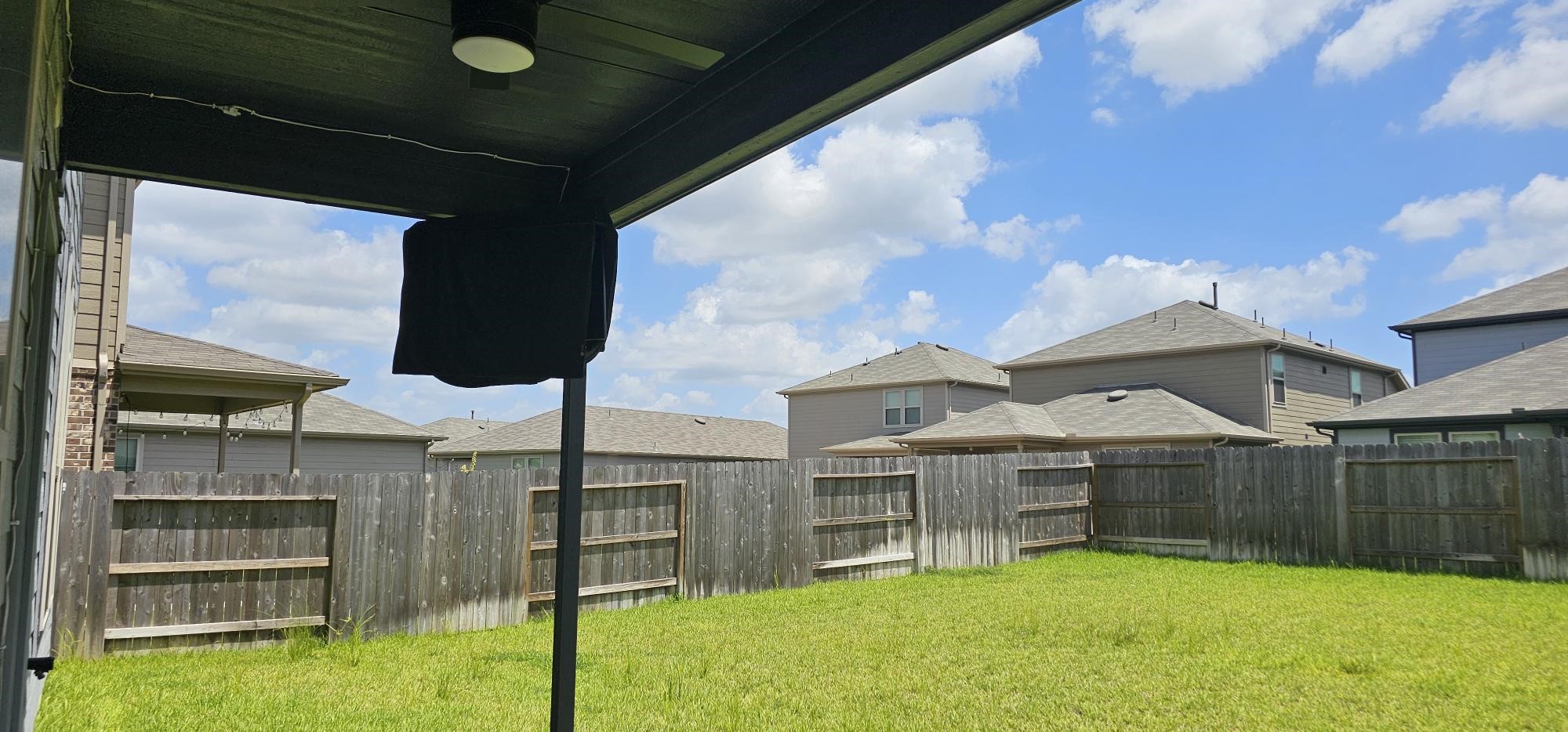 15000 Rustic Moon Road Conroe, TX 77302 - Photo 23 of 35 Covered back patio with a Mounted TV so you can invite your friends and family for a spirited game of Football, Baseball, Basketball