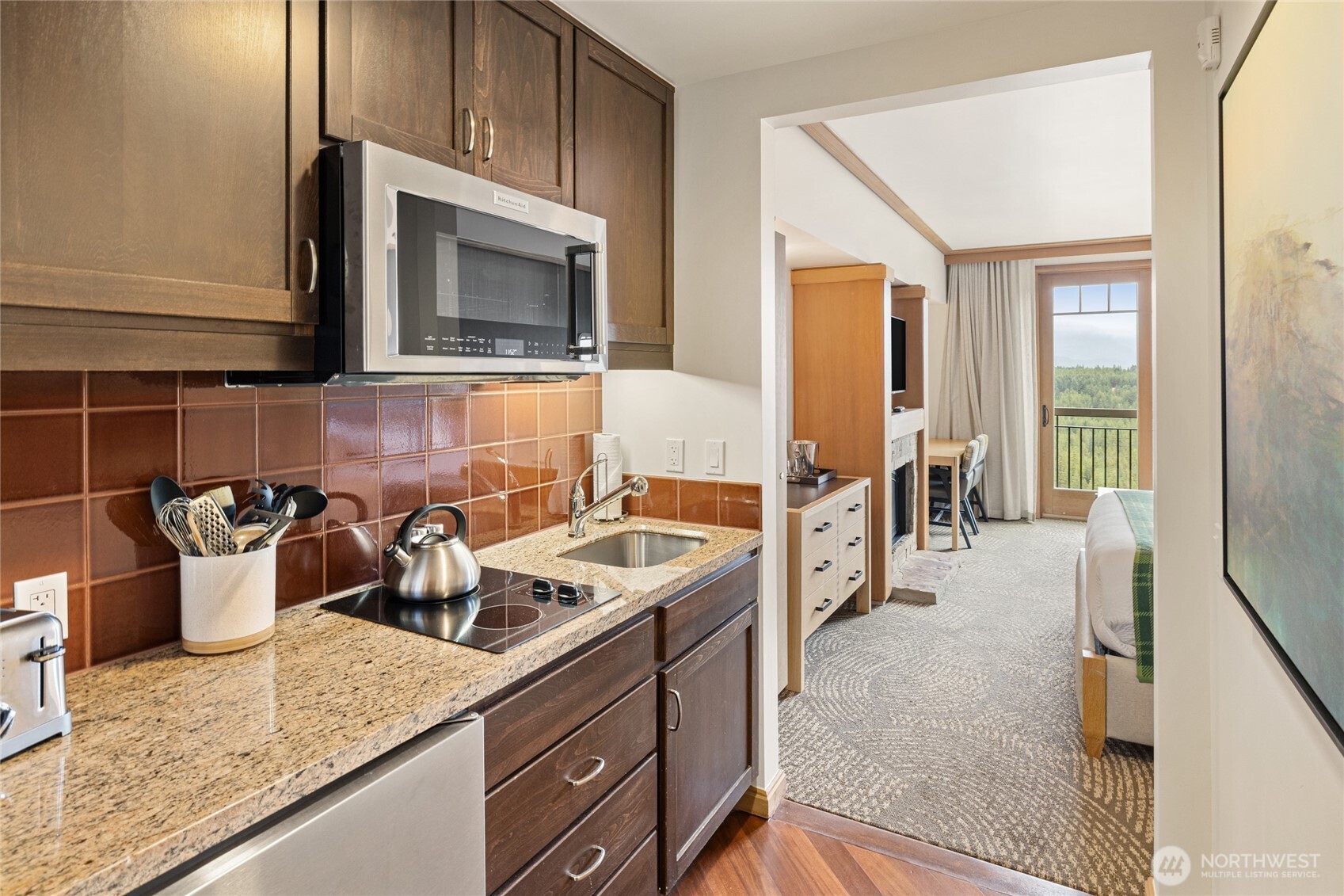 3600 Suncadia Trail, Unit 4049 Cle Elum, WA 98922 - Photo 19 of 26 a kitchen with a stove and a white cabinets