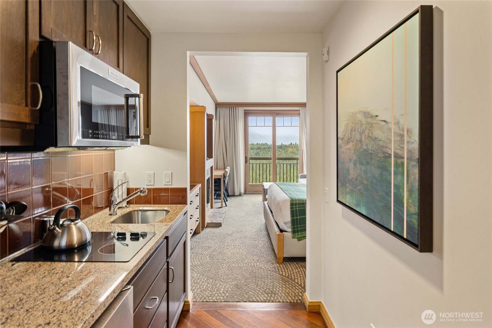 3600 Suncadia Trail, Unit 4049 Cle Elum, WA 98922 - Photo 20 of 26 a kitchen with a stove a sink and a refrigerator