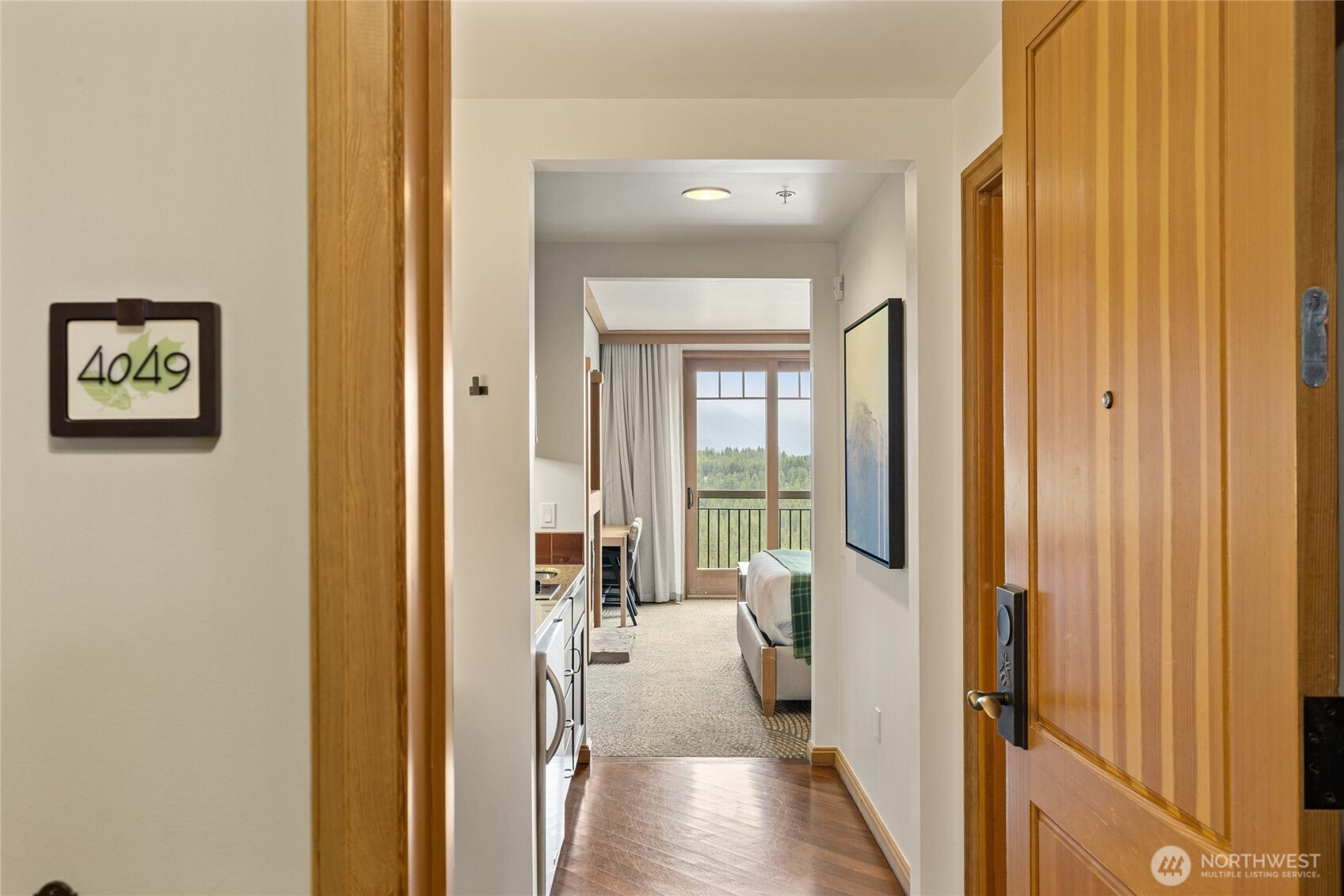 3600 Suncadia Trail, Unit 4049 Cle Elum, WA 98922 - Photo 2 of 26 a view of a hallway with a livingroom and a dinning room with furniture