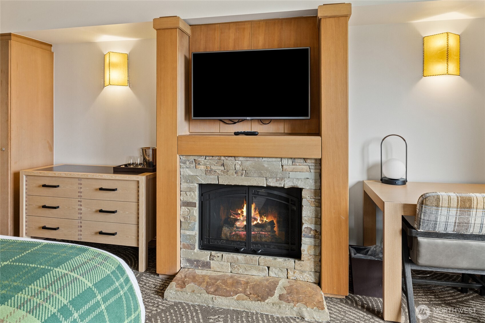3600 Suncadia Trail, Unit 4049 Cle Elum, WA 98922 - Photo 25 of 26 a living room with a fireplace and a flat screen tv