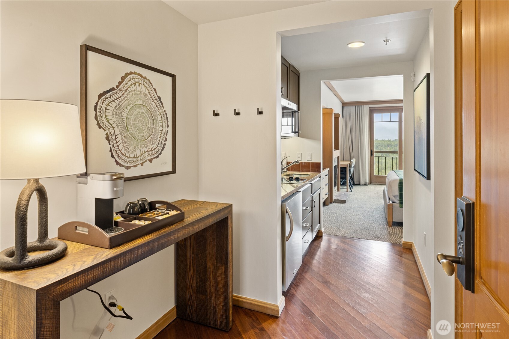 3600 Suncadia Trail, Unit 4049 Cle Elum, WA 98922 - Photo 3 of 26 a hallway with white cabinets and wooden floor