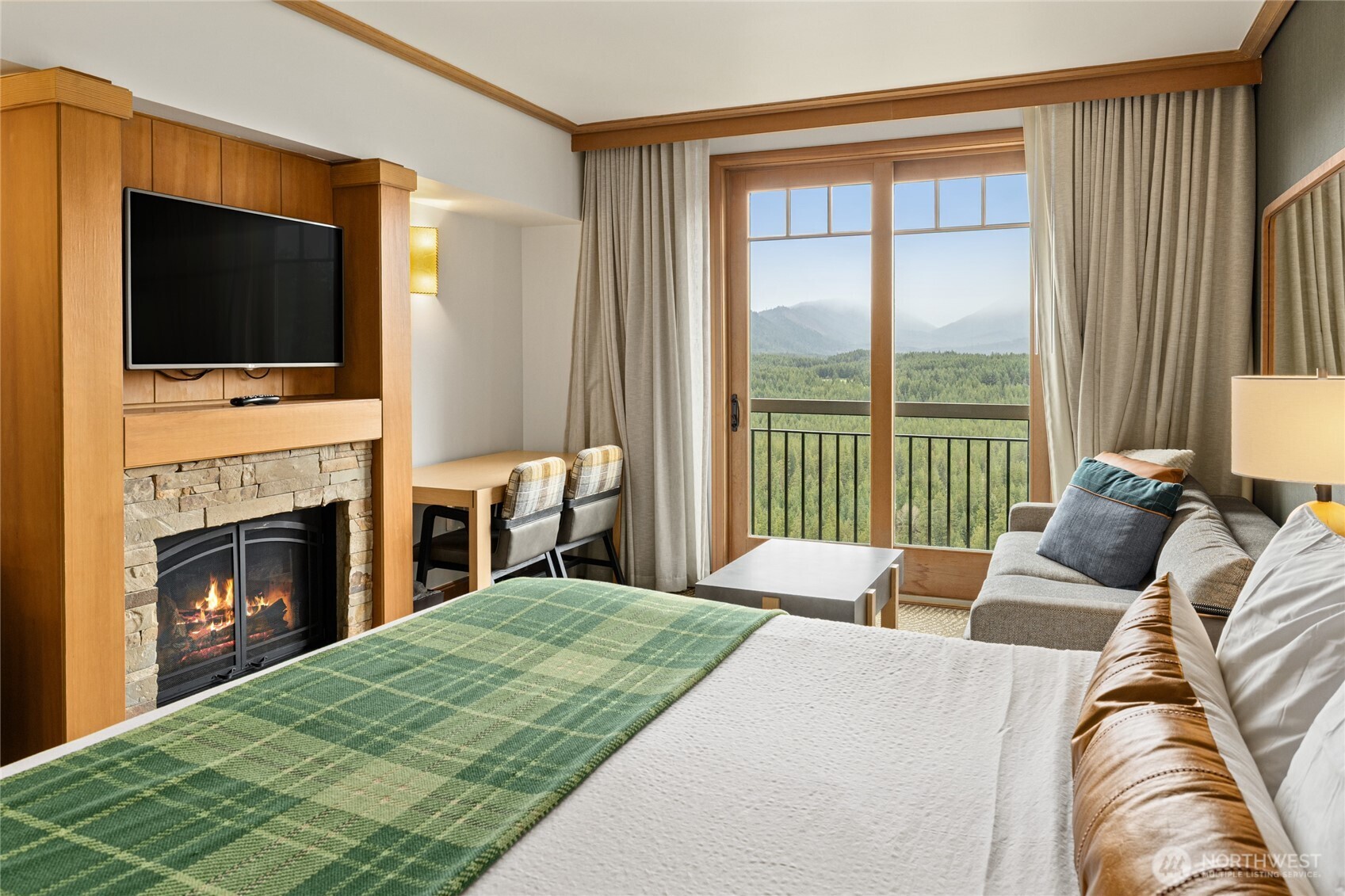 3600 Suncadia Trail, Unit 4049 Cle Elum, WA 98922 - Photo 7 of 26 a bedroom with a bed and a flat screen tv