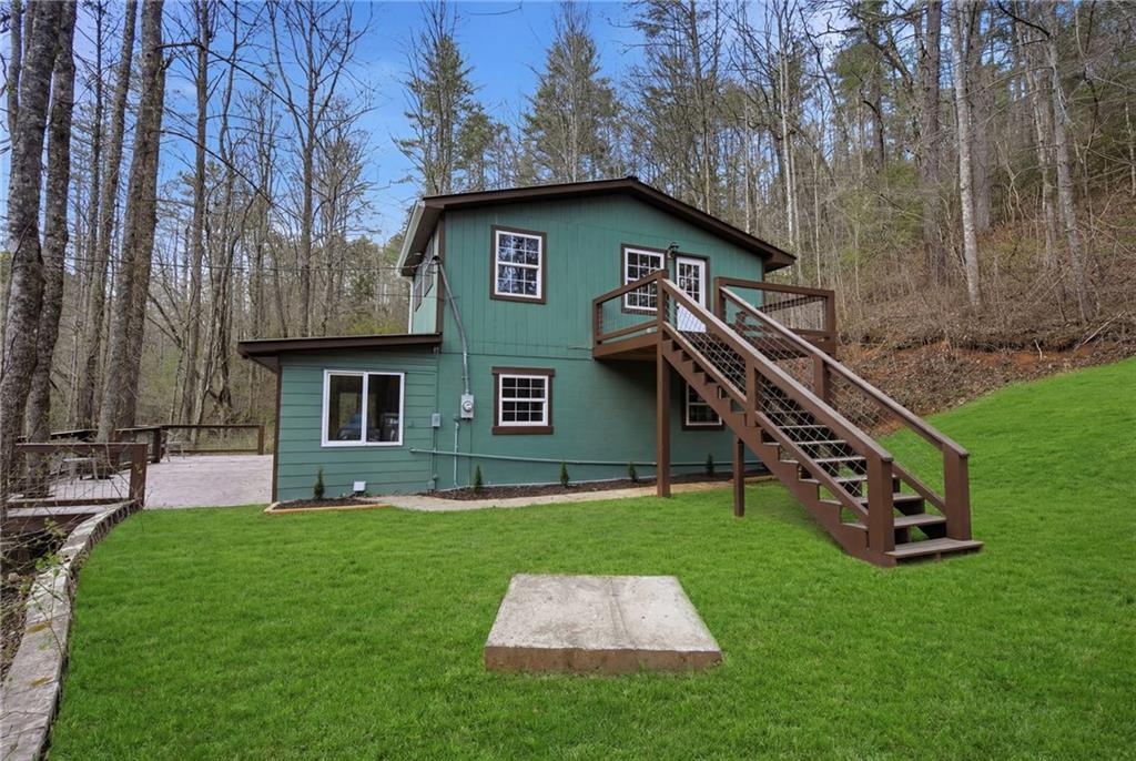 1780 Conasauga Road Ellijay, GA 30540 - Photo 35 of 43 a view of a house with a yard