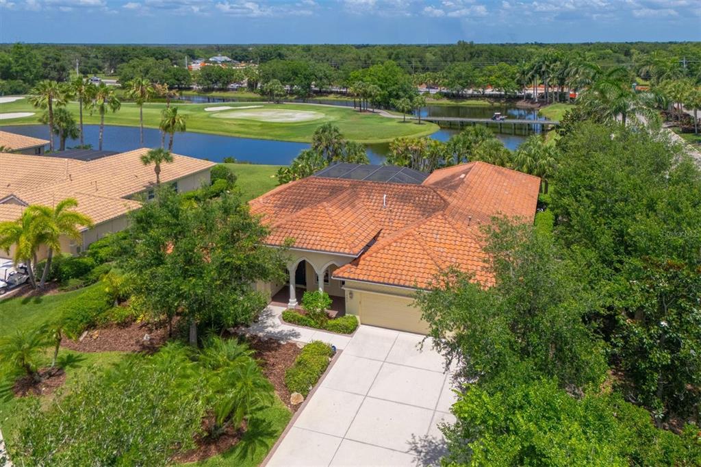 10622 Conch Shell Terrace Bradenton, FL 34212 - Photo 1 of 69 an aerial view of a house with garden space and street view