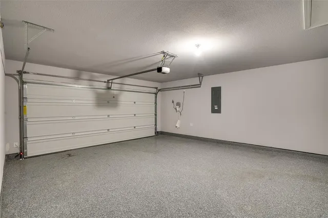 a blue house with a big yard and a large parking space