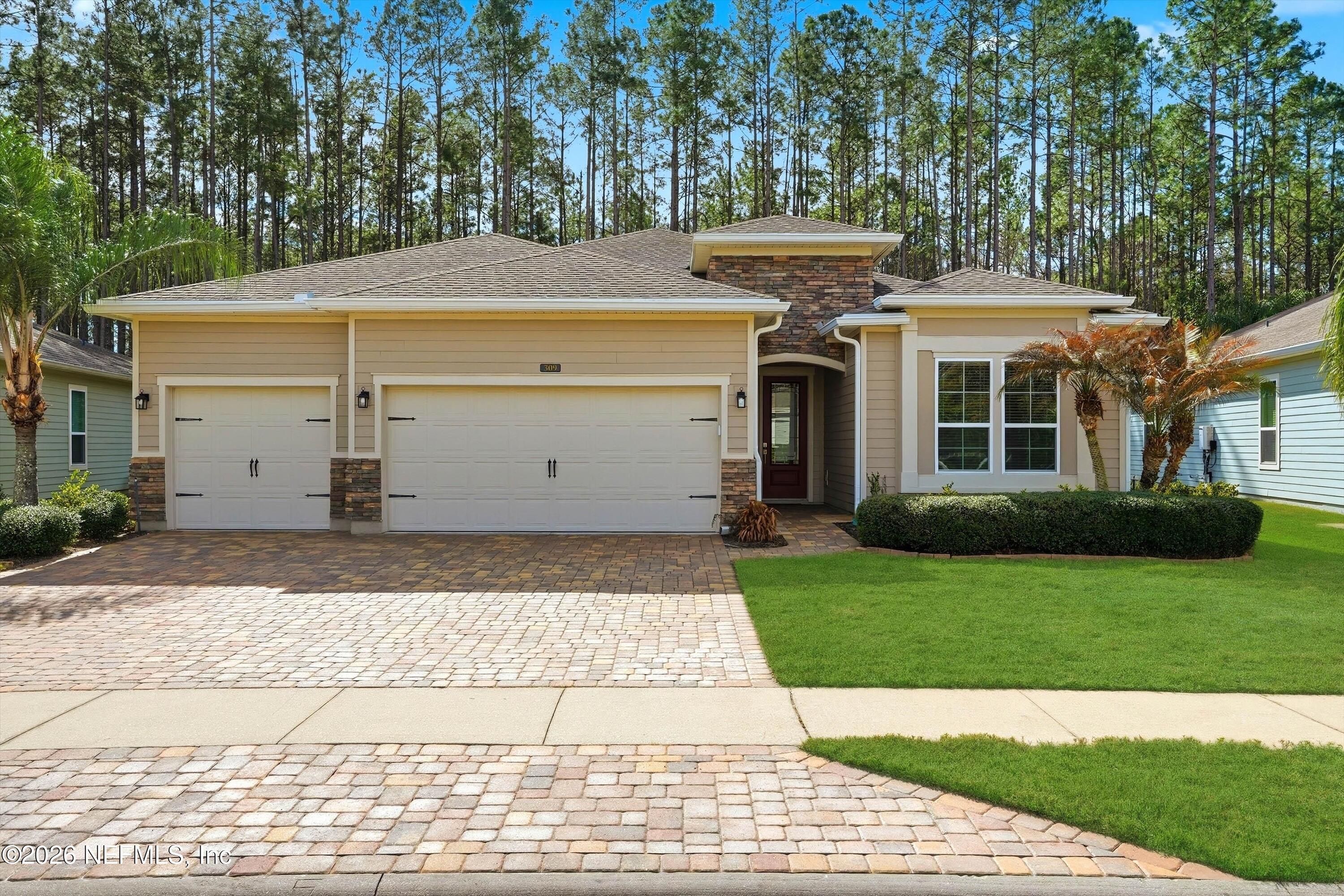 a view of a white house with a yard