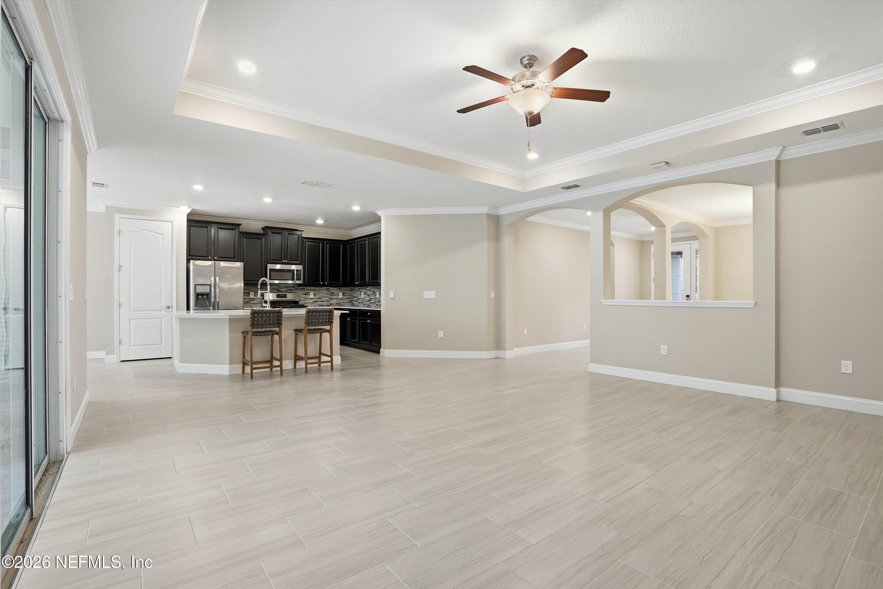 309 Coco Point St. Augustine, FL 32092 - Photo 12 of 50 a view of a livingroom with furniture and a ceiling fan