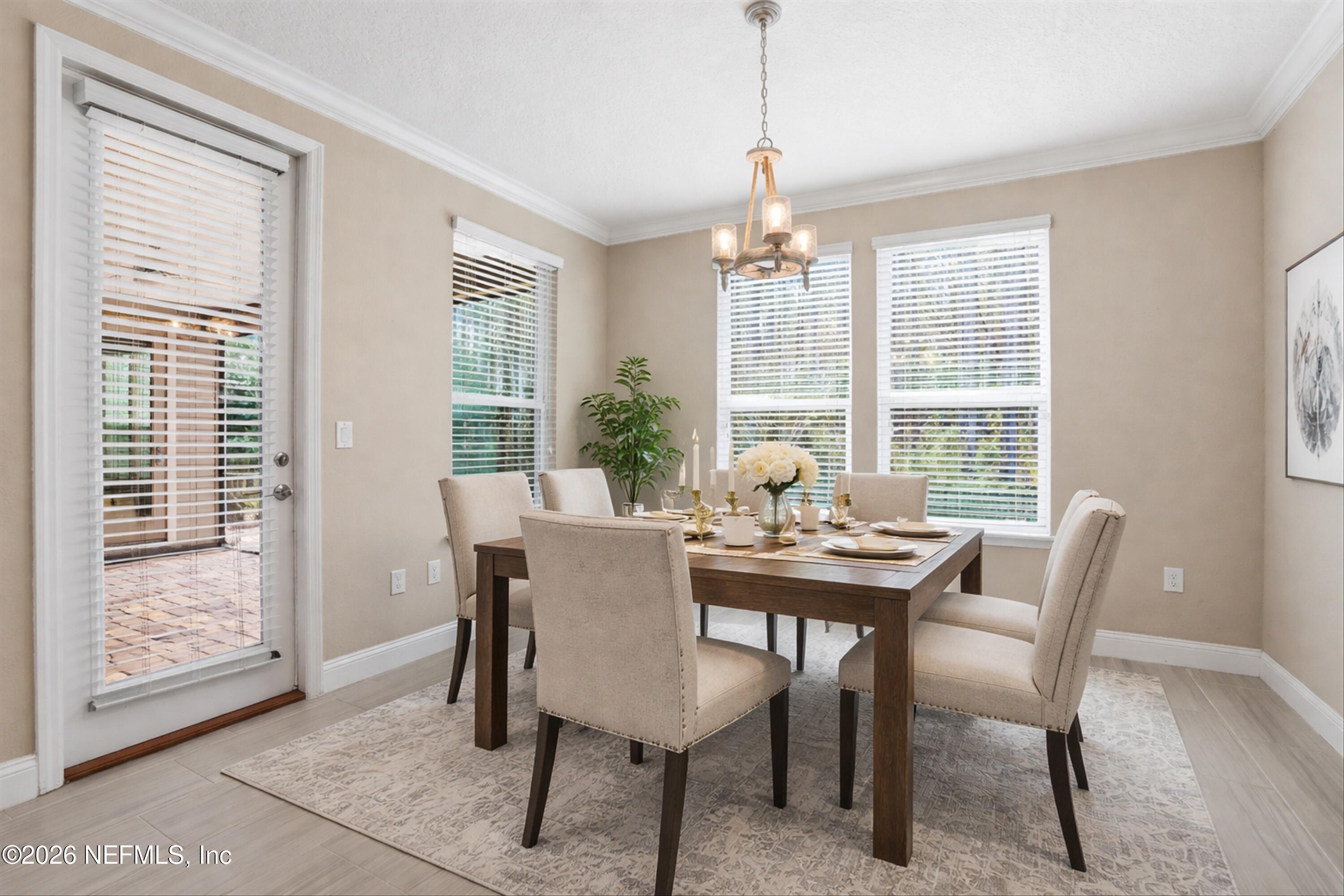 309 Coco Point St. Augustine, FL 32092 - Photo 17 of 50 a view of a dining room with furniture window and outside view
