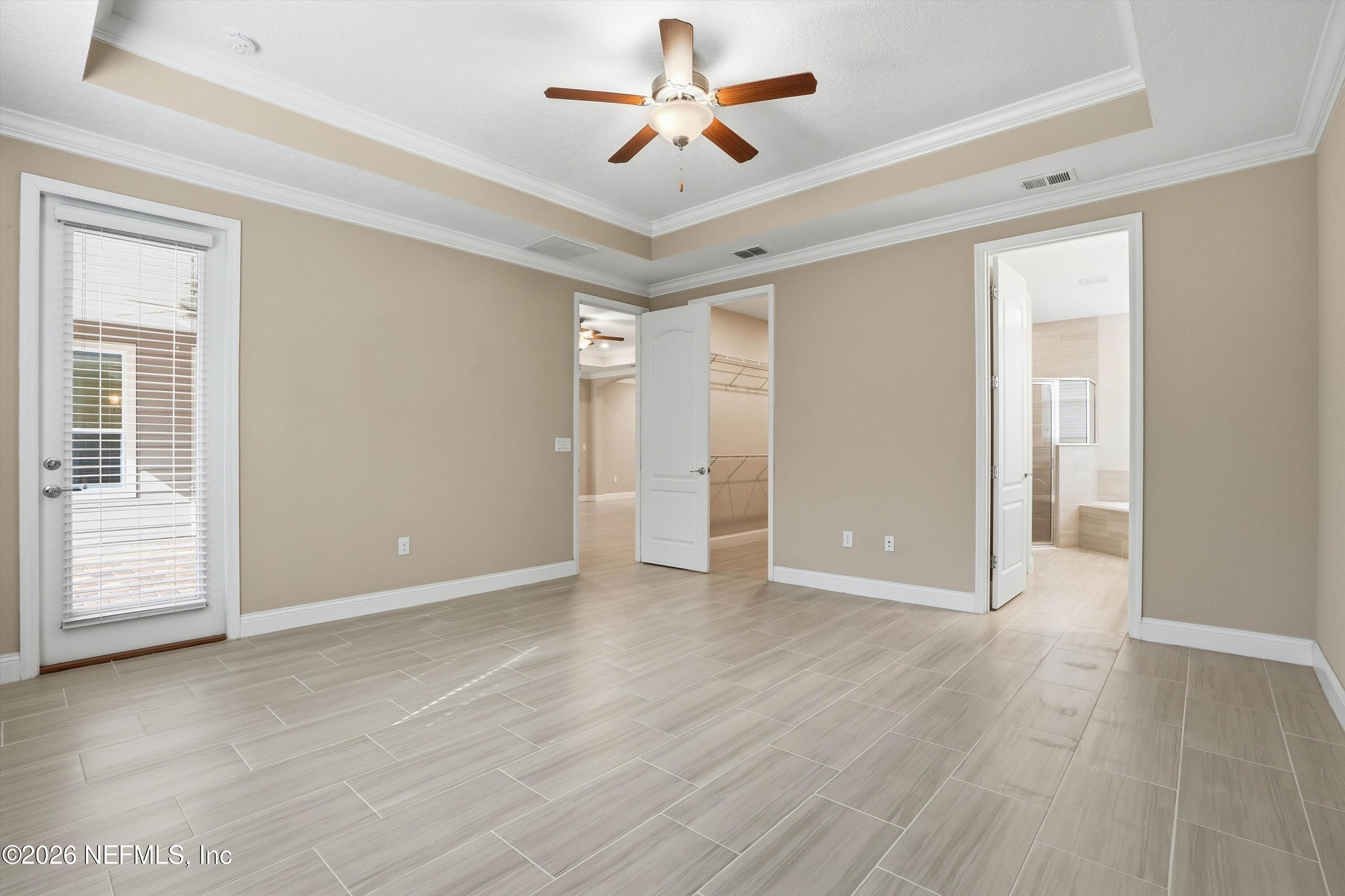 309 Coco Point St. Augustine, FL 32092 - Photo 22 of 50 wooden floor in an empty room with a window