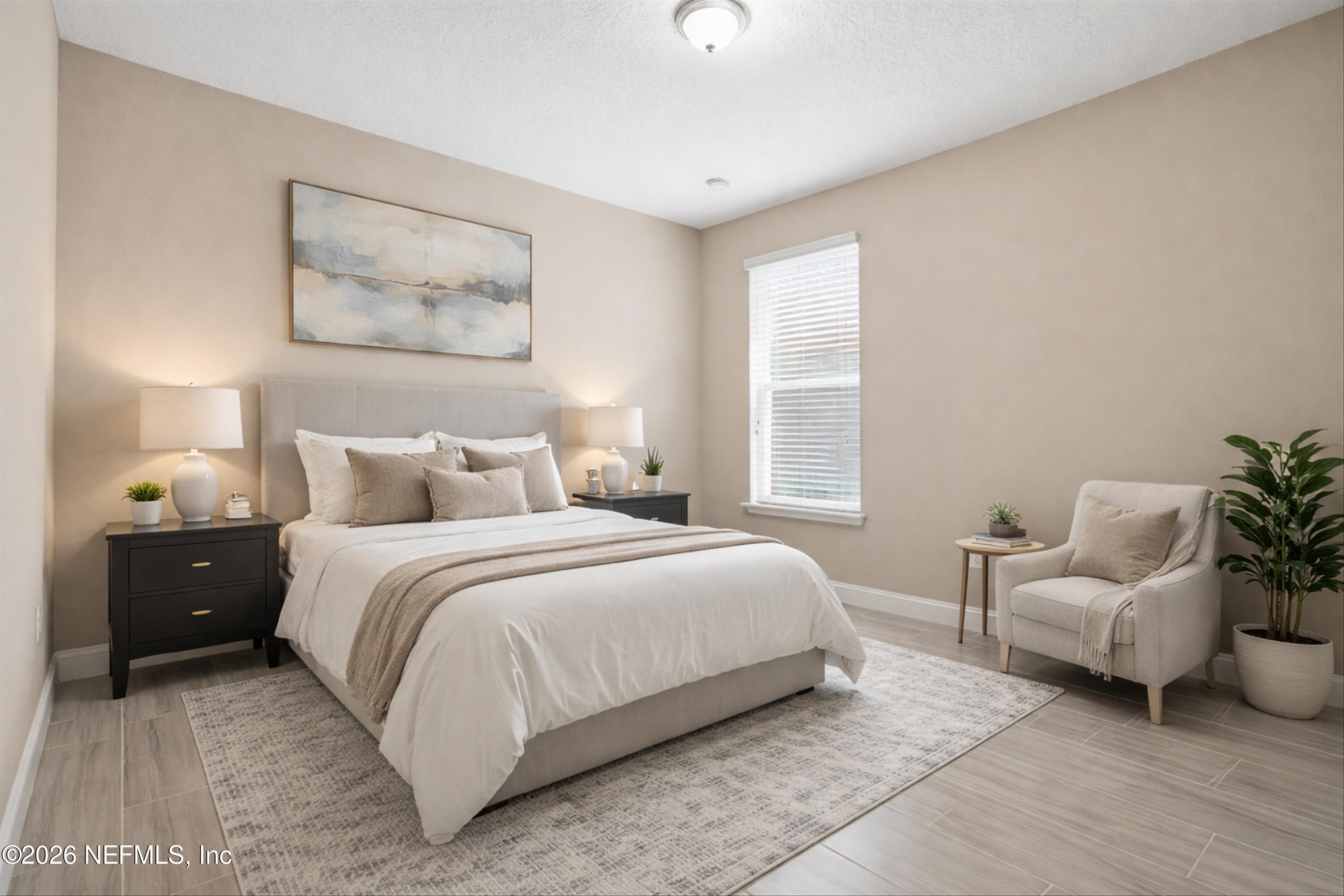 309 Coco Point St. Augustine, FL 32092 - Photo 26 of 50 a bedroom with a bed and a couch