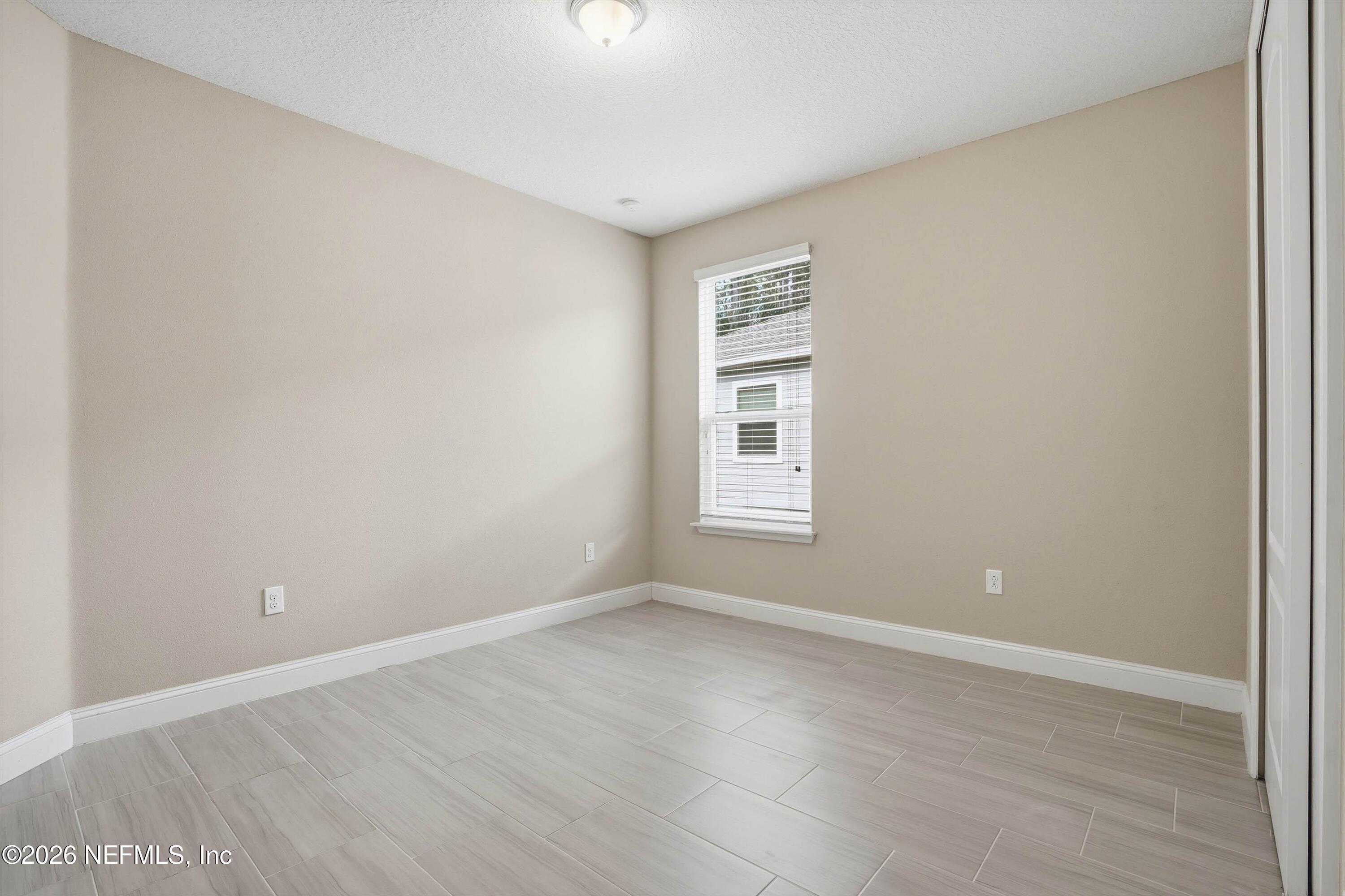 309 Coco Point St. Augustine, FL 32092 - Photo 29 of 50 a view of a room with wooden floor and windows