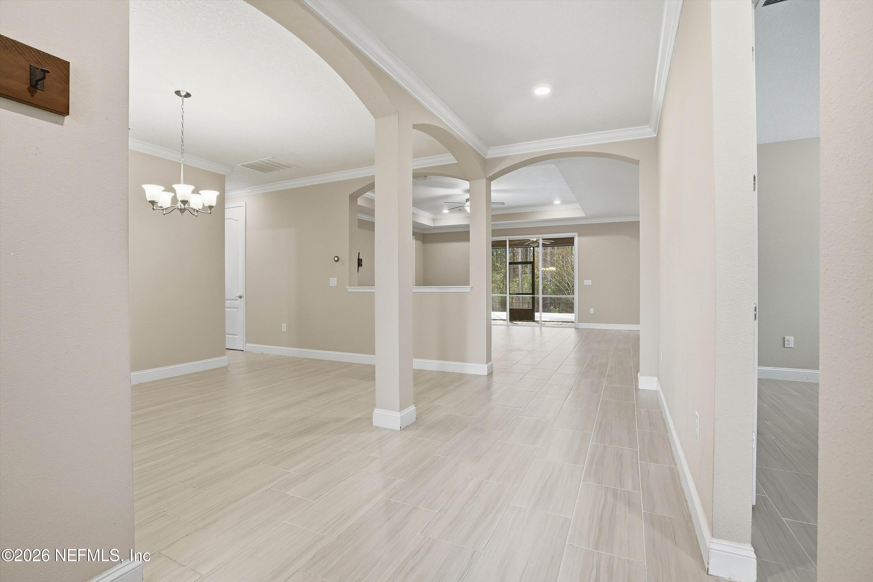 309 Coco Point St. Augustine, FL 32092 - Photo 4 of 50 en empty room with wooden floor