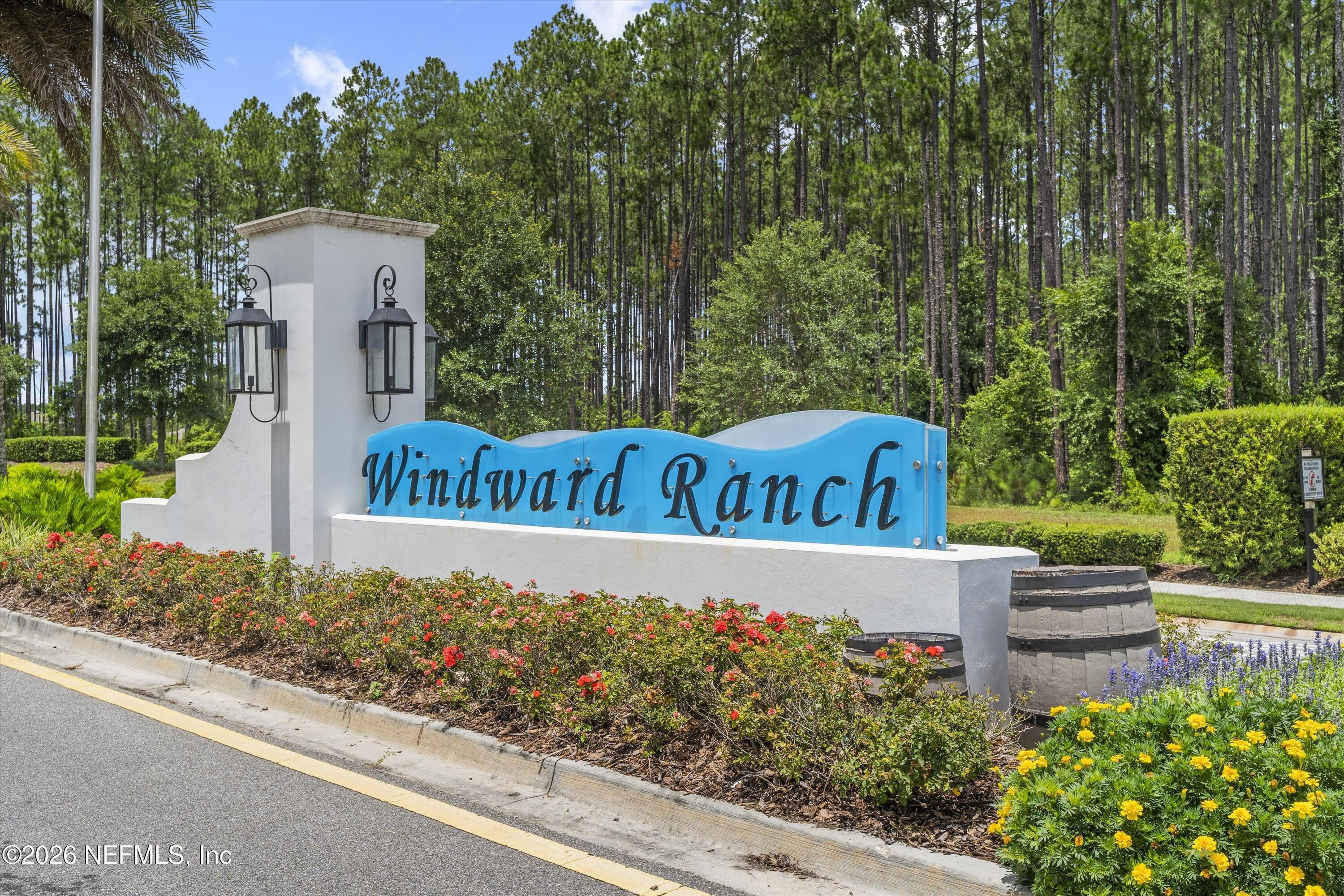 309 Coco Point St. Augustine, FL 32092 - Photo 41 of 50 a view of sign board with flower around