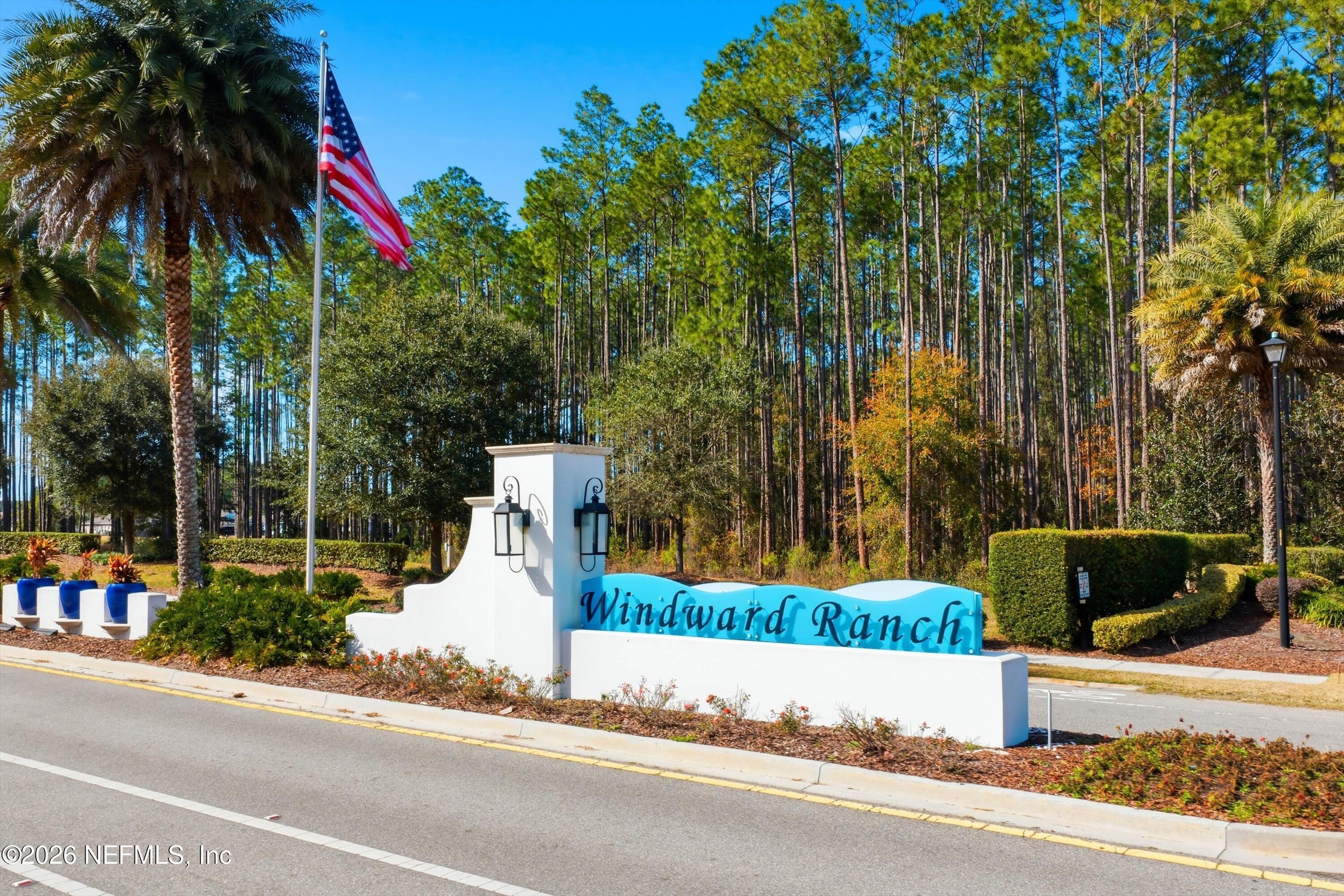 309 Coco Point St. Augustine, FL 32092 - Photo 42 of 50 front view of a house with a yard and potted plants