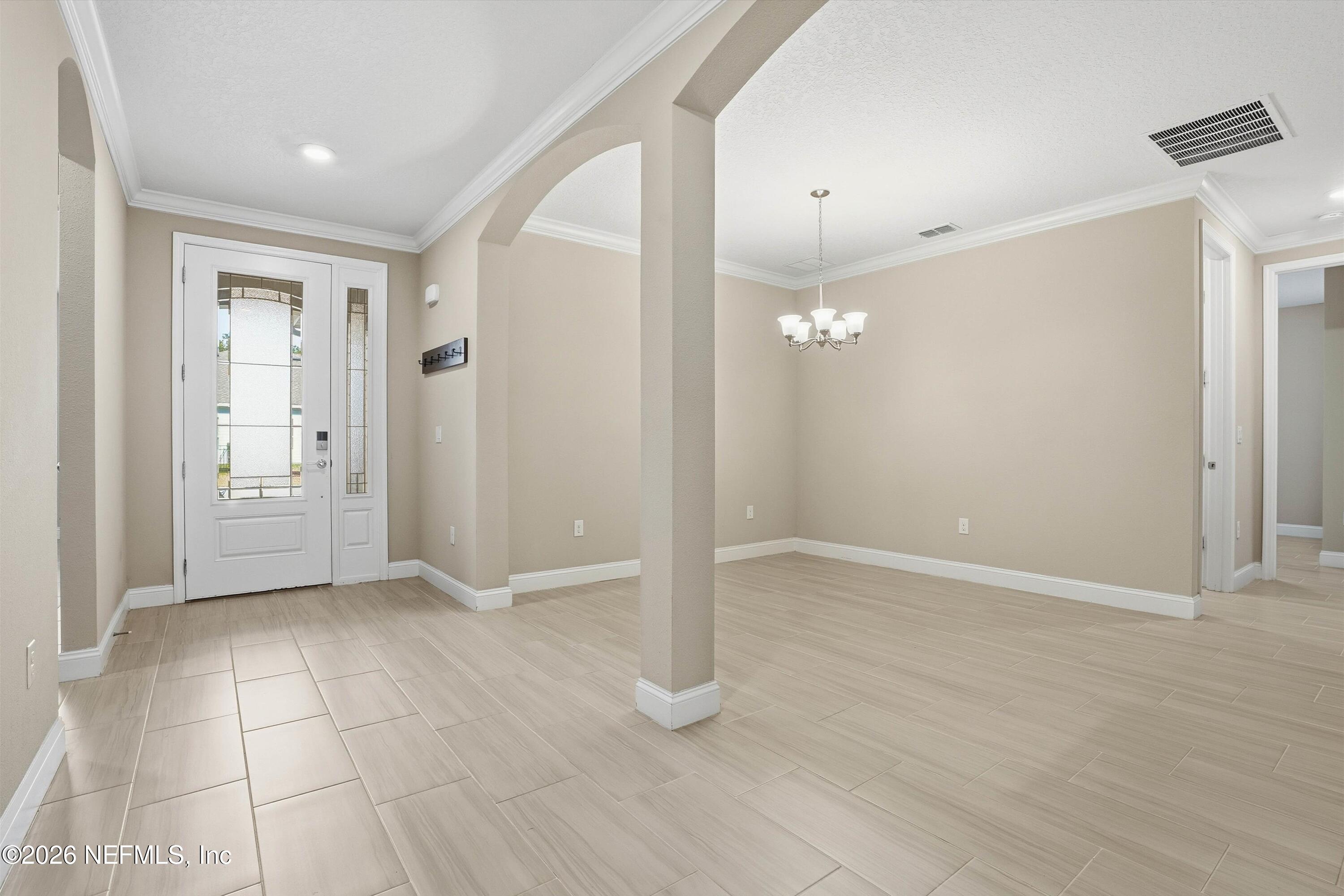 309 Coco Point St. Augustine, FL 32092 - Photo 5 of 50 an empty room with wooden floor and bathroom