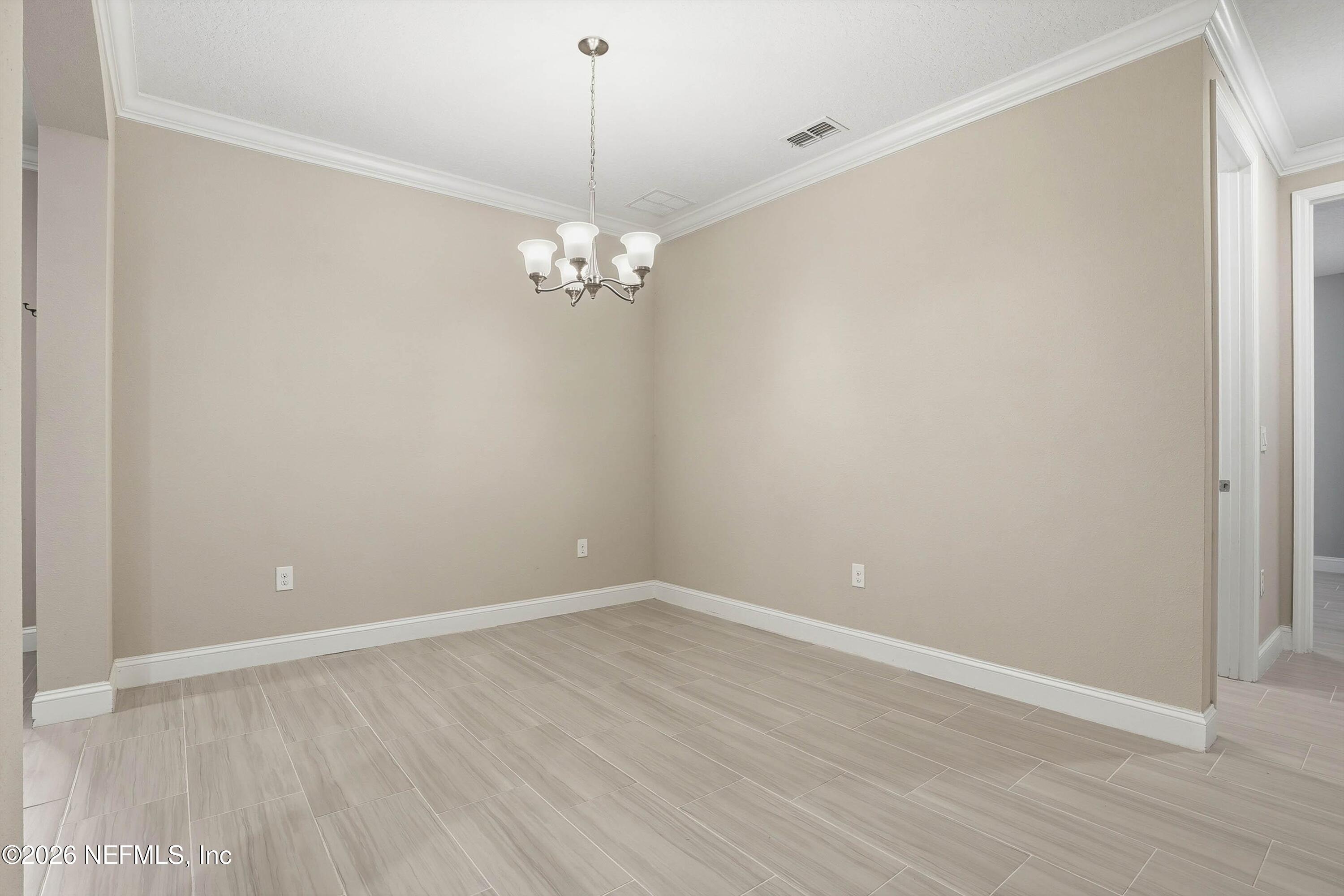 309 Coco Point St. Augustine, FL 32092 - Photo 7 of 50 a view of empty room with wooden floor