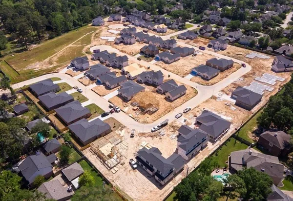 an aerial view of residential houses with outdoor space