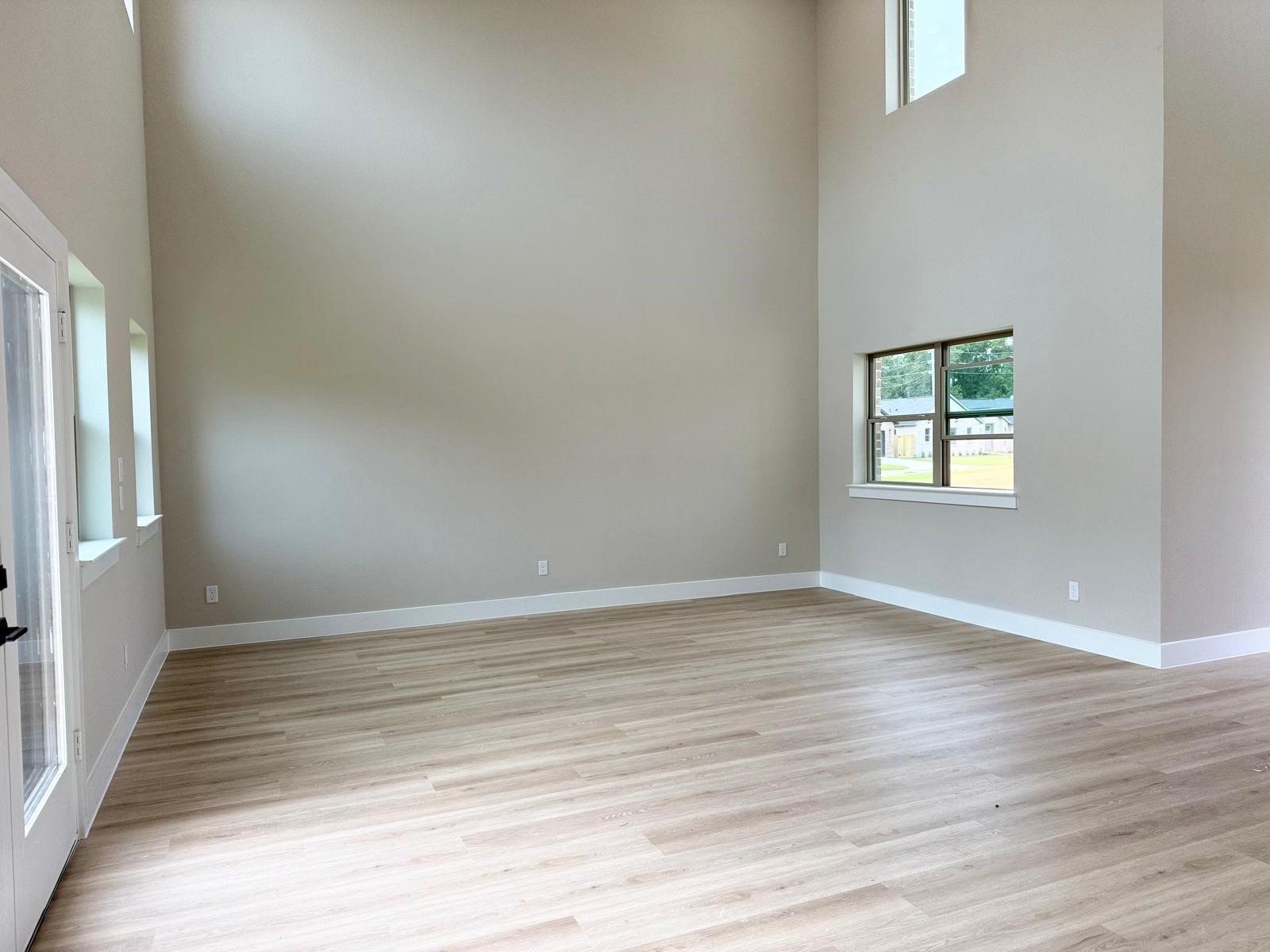 2615 Liguria Ln Spring Spring, TX 77388 - Photo 3 of 29 wooden floor in an empty room with a window