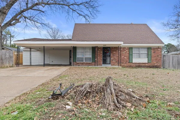 front view of a house with a yard