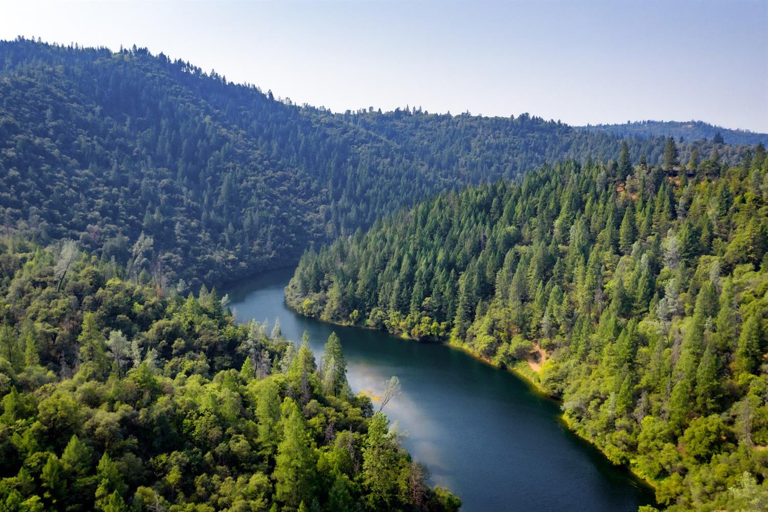 2095 Wild Goose Canyon Road Placerville, CA 95667 - Photo 17 of 20 a view of a lake with a mountain in the background