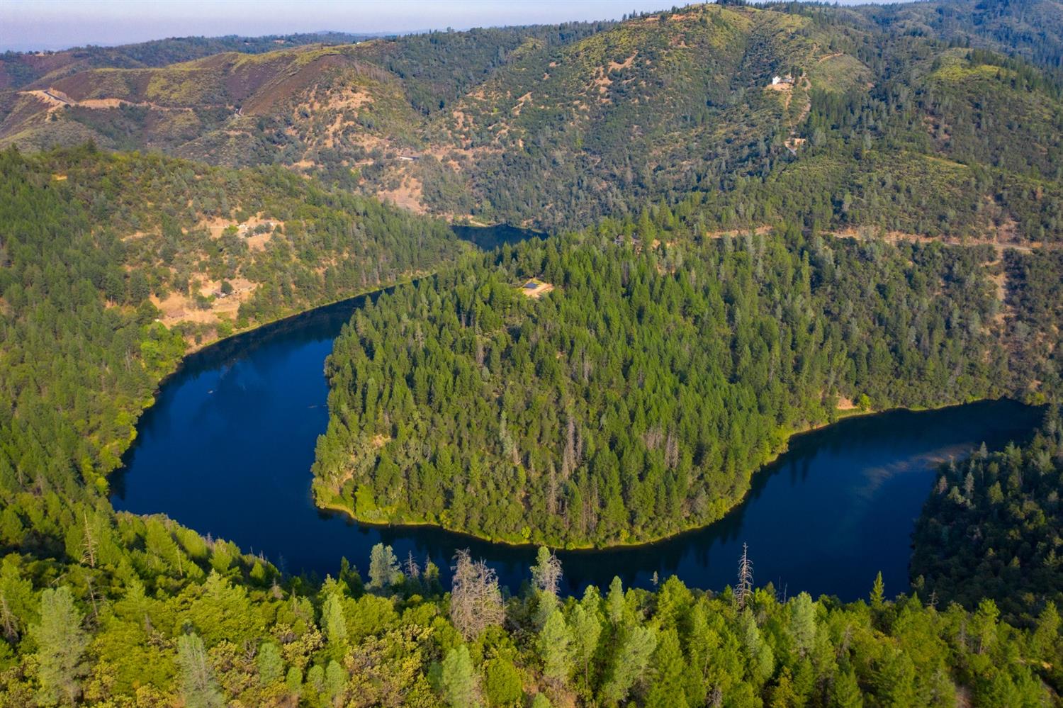 2095 Wild Goose Canyon Road Placerville, CA 95667 - Photo 3 of 20 a view of a garden with a building in the background
