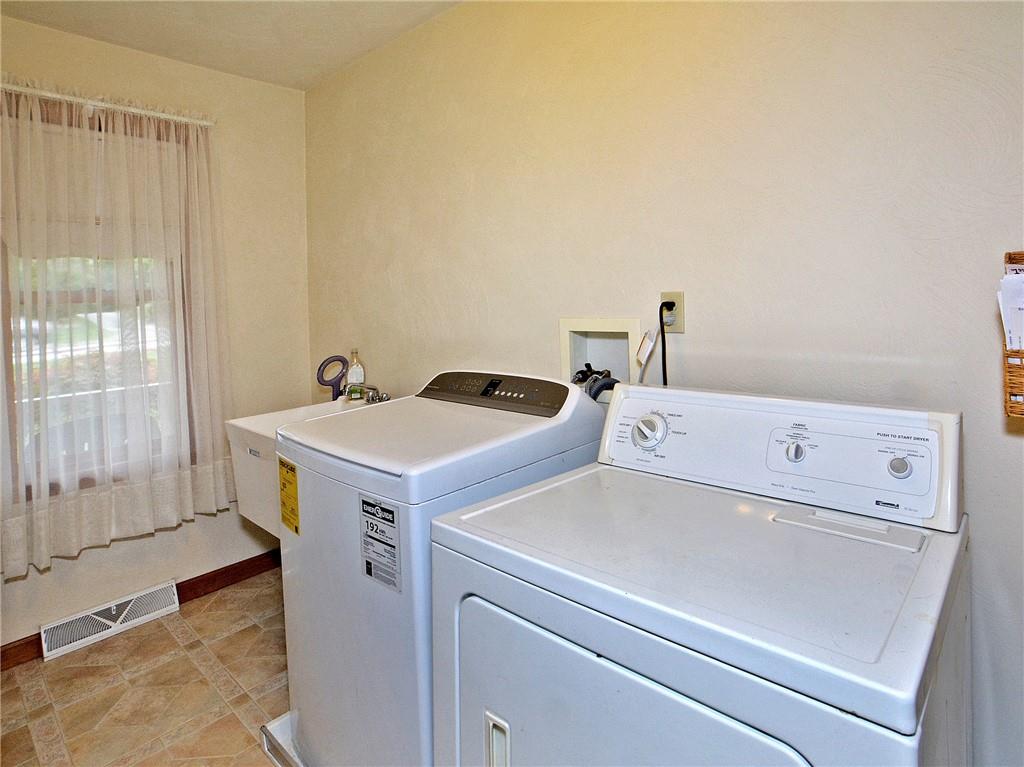2145 Haymaker Road Monroeville, PA 15146 - Photo 22 of 25 First floor laundry room with washer and dryer included. Lots of space for storage and shelving.