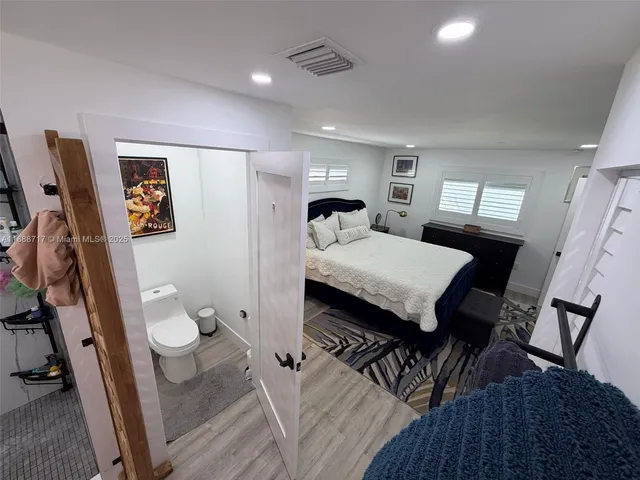 a kitchen with stainless steel appliances kitchen island granite countertop a stove and a refrigerator