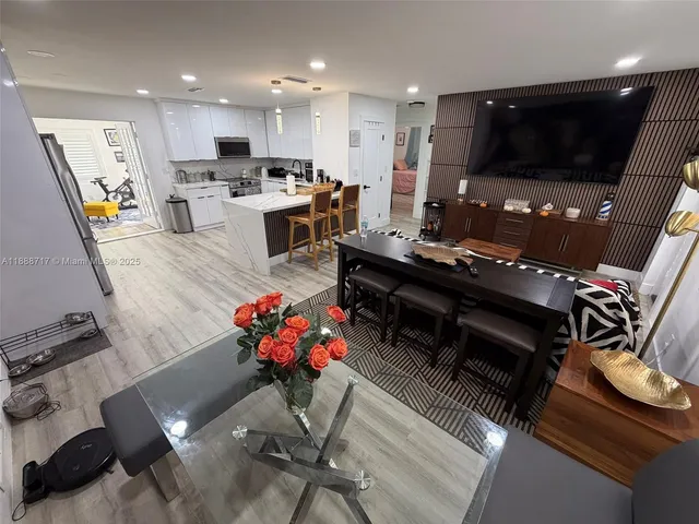 a large kitchen with cabinets and stainless steel appliances