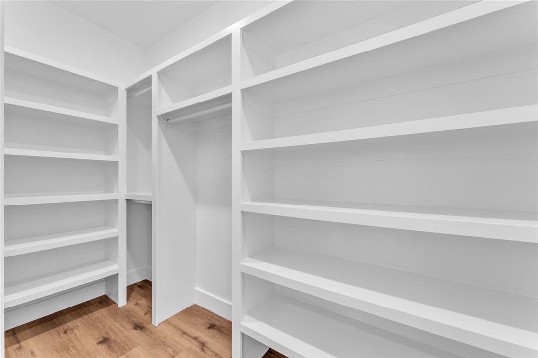 1723 Harris Bridge Road Anderson, SC 29621 - Photo 17 of 33 Custom shelving and hanging space craft a well-organized walk-in closet.
