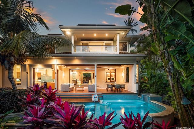 a view of swimming pool with chairs
