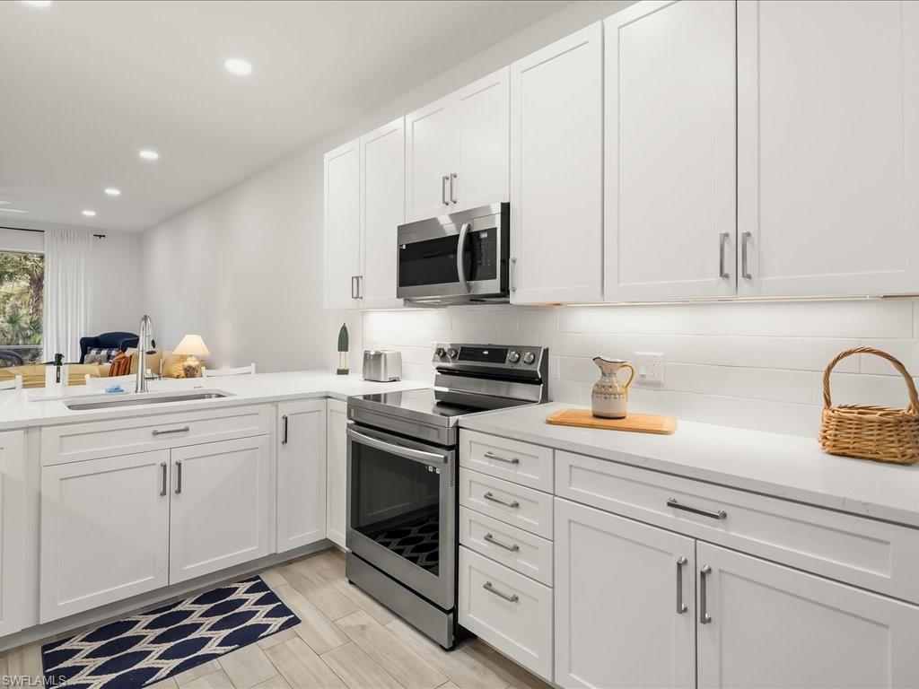 501 Robin Hood Circle, Unit 101 Naples, FL 34104 - Photo 1 of 25 Remodeled Kitchen