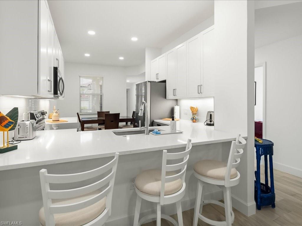 501 Robin Hood Circle, Unit 101 Naples, FL 34104 - Photo 5 of 25 Remodeled Kitchen