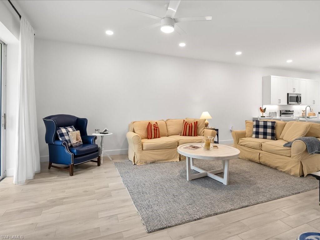 501 Robin Hood Circle, Unit 101 Naples, FL 34104 - Photo 10 of 25 Living Room