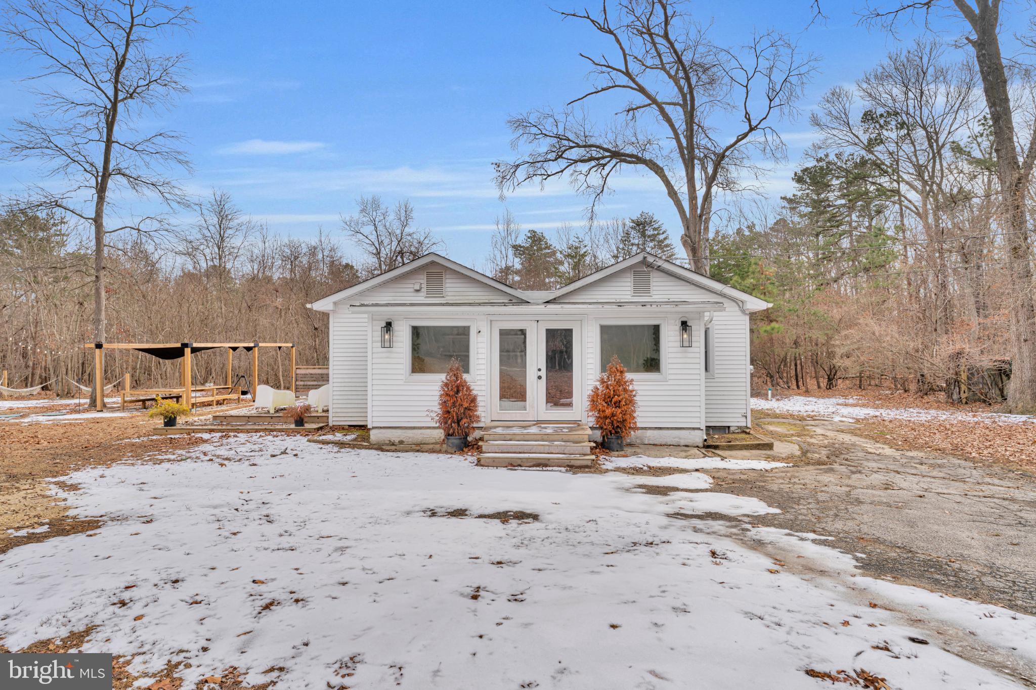 572 Zoe Road Sicklerville, NJ 08081 - Photo 2 of 42 a front view of a house with two trees in it