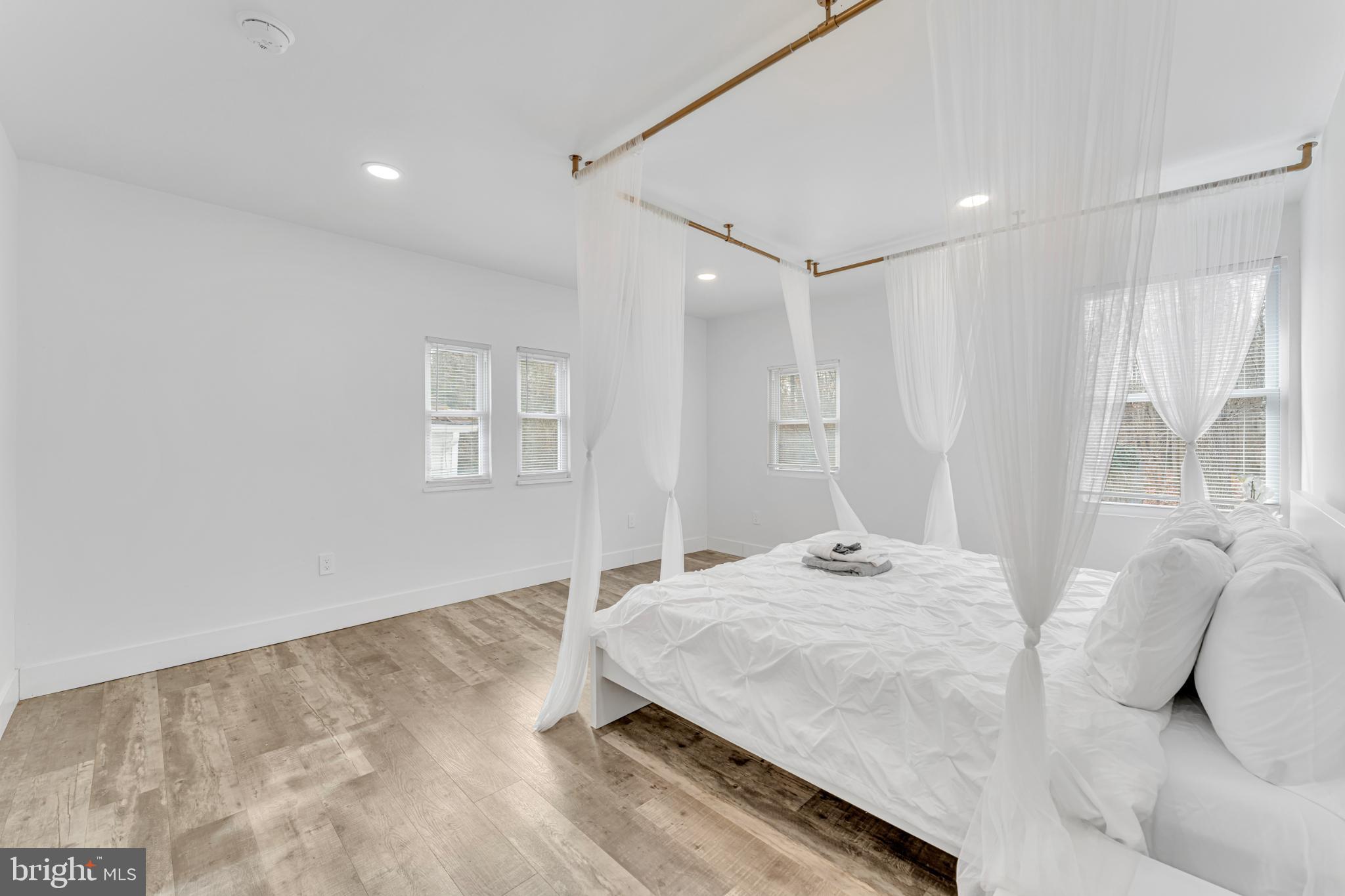 572 Zoe Road Sicklerville, NJ 08081 - Photo 24 of 40 Serene bedroom with airy, minimalist design.