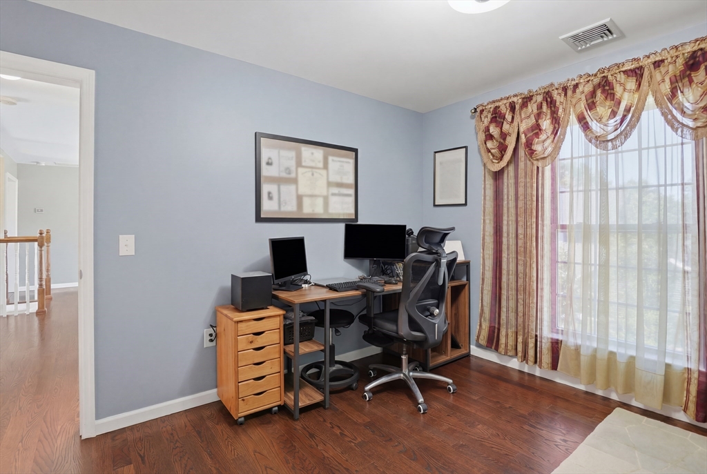 112 Pineland Avenue Worcester, MA 01604 - Photo 24 of 38 a view of a workspace with furniture and a window