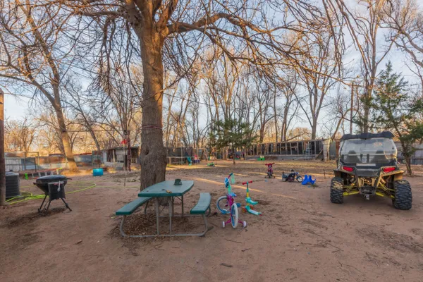 a view of a house with a yard covered in snow