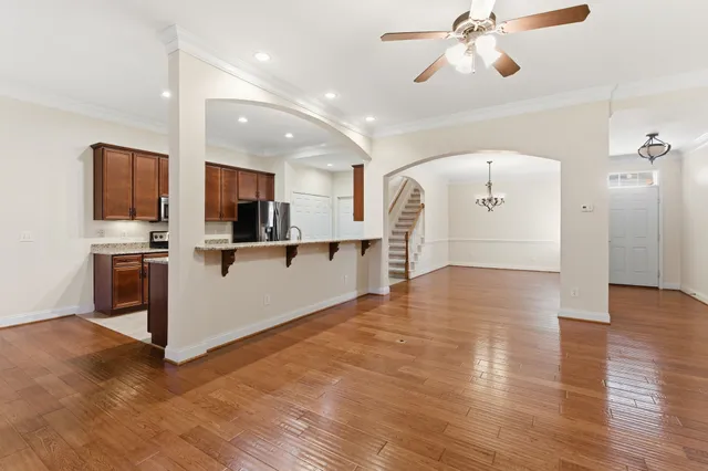 a view of kitchen with cabinets and wooden floor