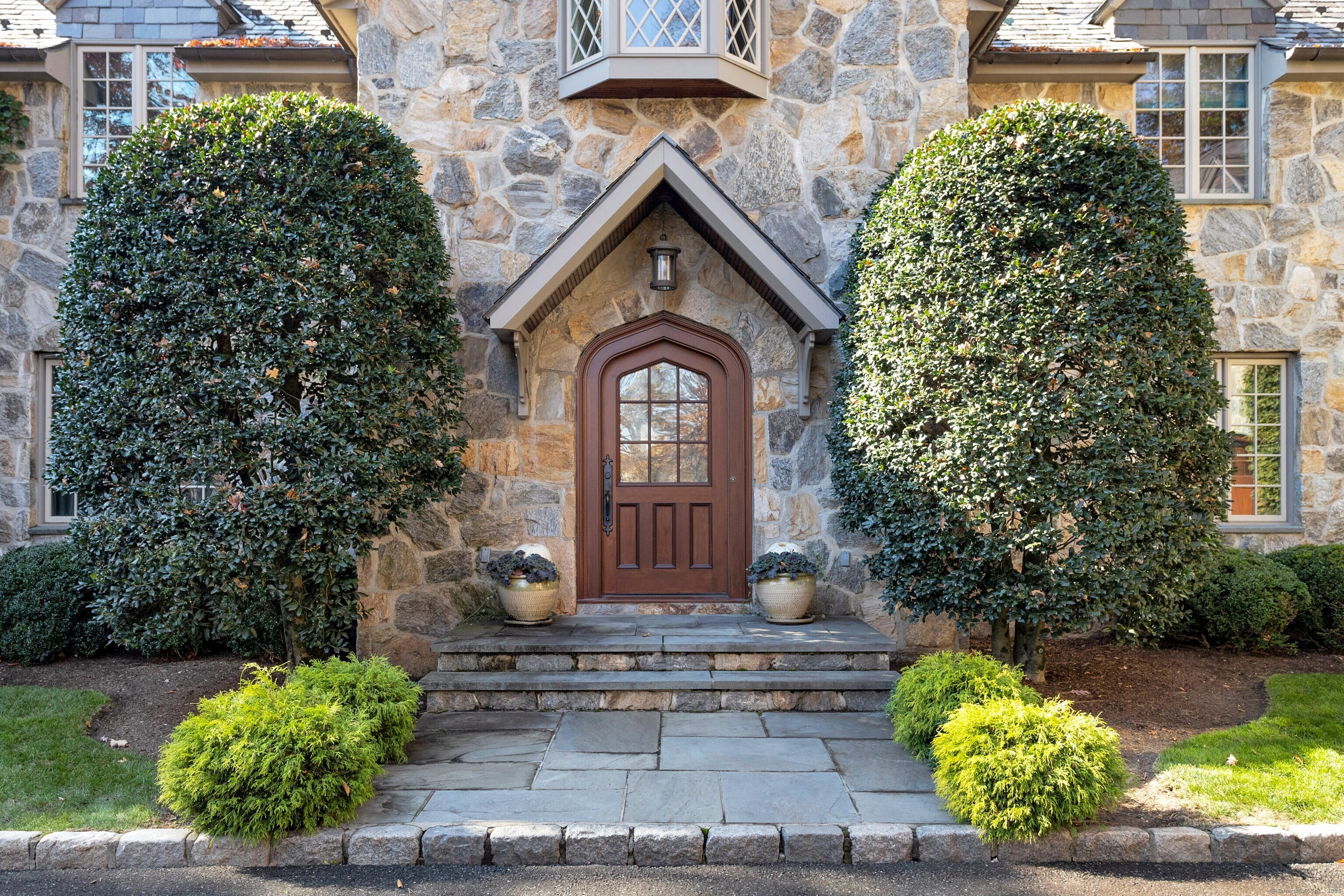 76 Arrowhead Way Darien, CT 06820 - Photo 1 of 1 a front view of a house with a yard