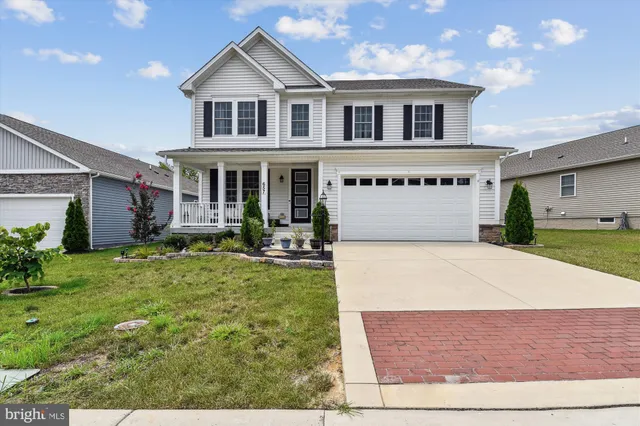 a house with garden in front of it