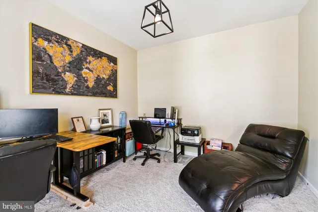 a kitchen with granite countertop stainless steel appliances and wooden cabinets