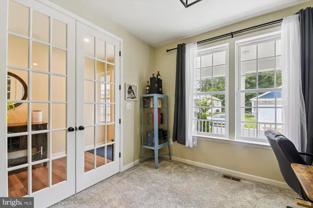 a kitchen with stainless steel appliances granite countertop a kitchen island a stove and a wooden floors