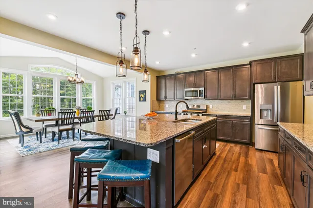a bedroom with furniture and a large window