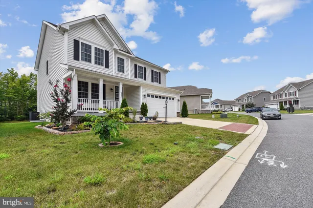 a front view of a house with a porch