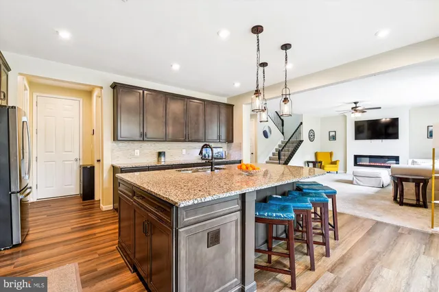 a bedroom with furniture and a wooden floor