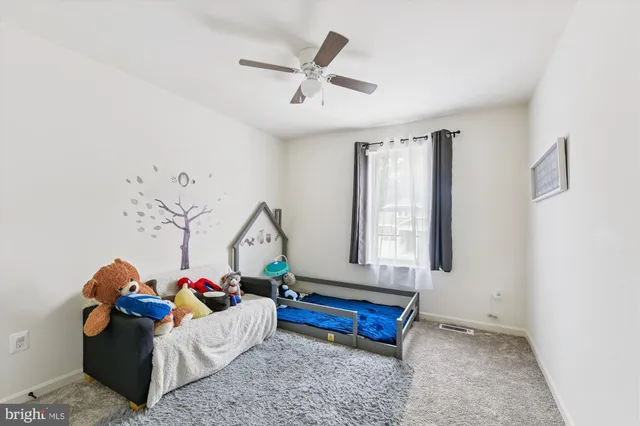 a view of backyard with swimming pool and outdoor seating