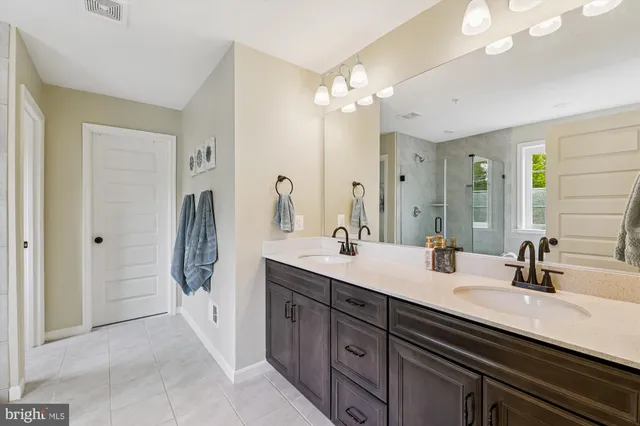 a view of a swimming pool with outdoor seating and plants